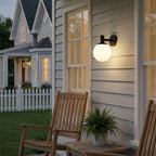 Lucande Dangan outdoor wall light, black/white, Ø 8 in, glass