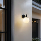 Lucande Dangan outdoor wall light, black/white, Ø 8 in, glass