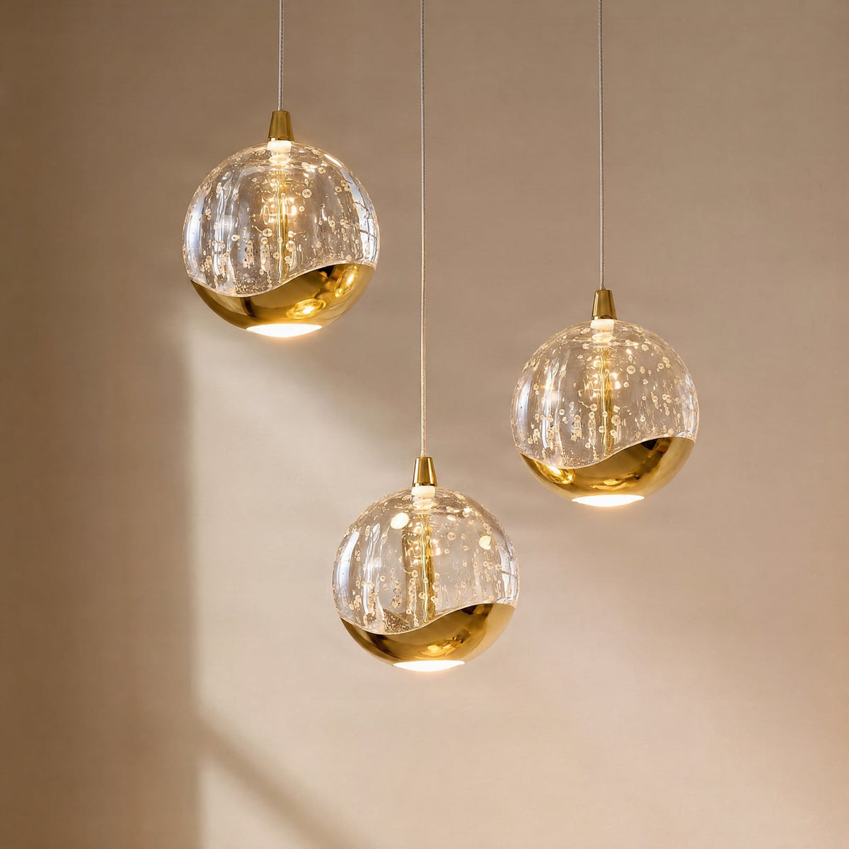 Lucande Hayley LED pendant light, Ø 9 inches, 3-bulb, gold, glass