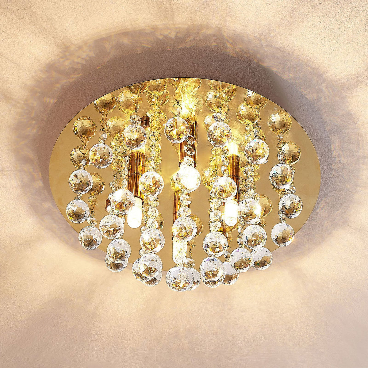 Lucande Gillion ceiling lamp, 4-bulb, gold, crystal, Ø13.8 inches