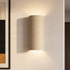 Lucande Colja wall light, round, height 12 in, plaster, beige
