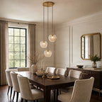 Lucande William pendant light, 3-bulb, brass/amber, glass