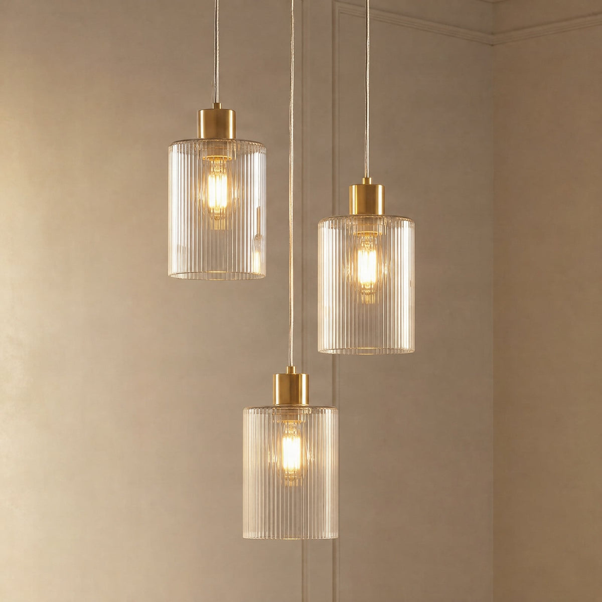 Lucande Carlie hanging light, 3-bulb, brass/clear, Ø 12.21 in