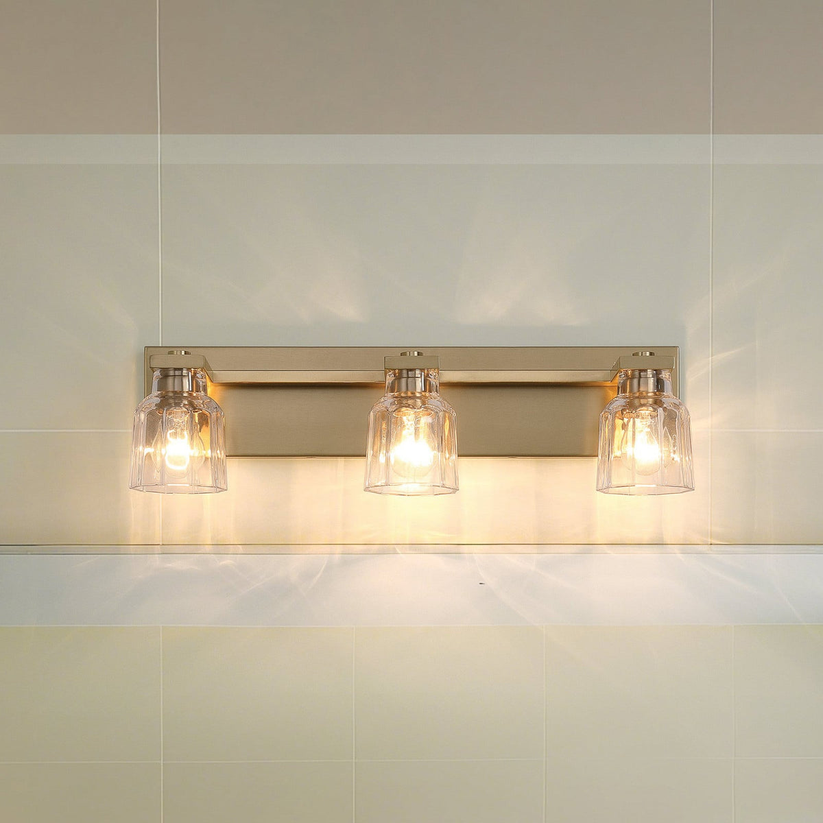 Thesis Dryden bathroom wall lamp, gold, 3-bulb, 24 in, metal/glass