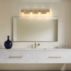 Thesis Dryden bathroom wall lamp, gold, 4-bulb, 32 in, metal and glass