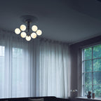 Nuura Apiales 9 ceiling light, brushed brass/opal, Ø 23.4 in